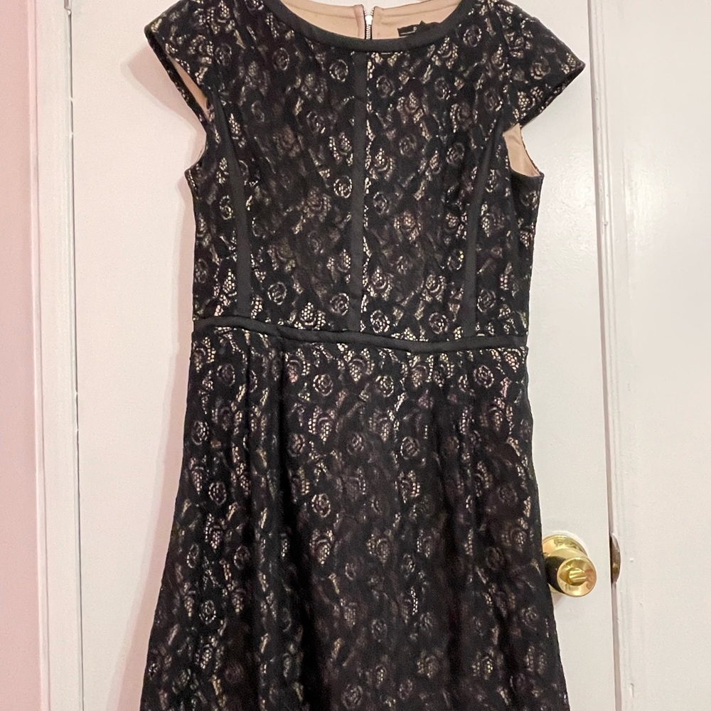 Black lace over nude lining. Very chic and sophisticated.